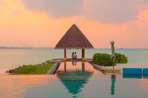 A couple on their honeymoon looking over the water