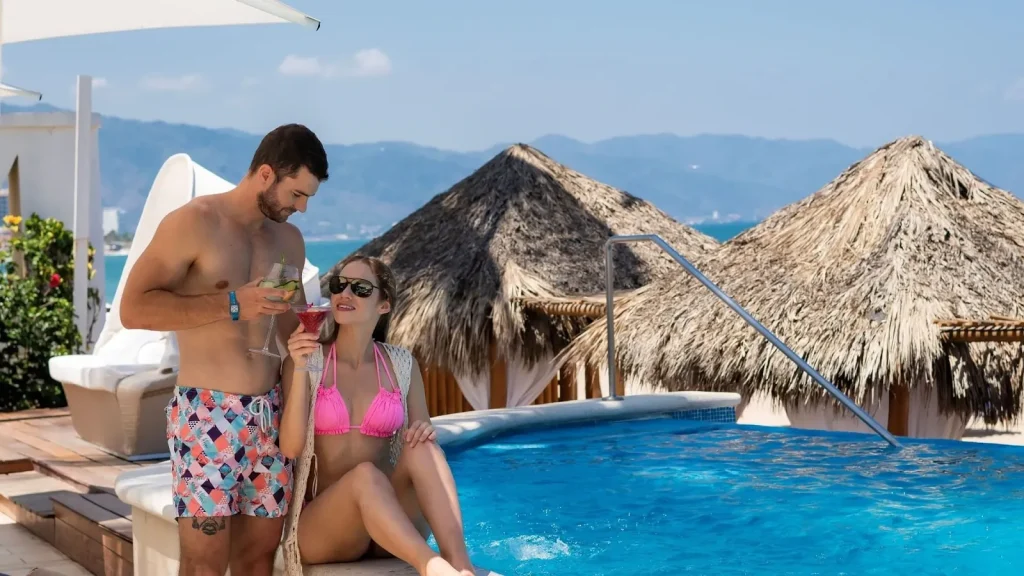 A couple at a boutique hotel pool