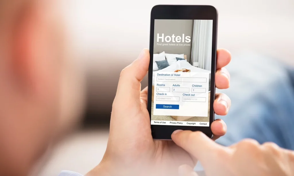 Person using a mobile hotel booking application