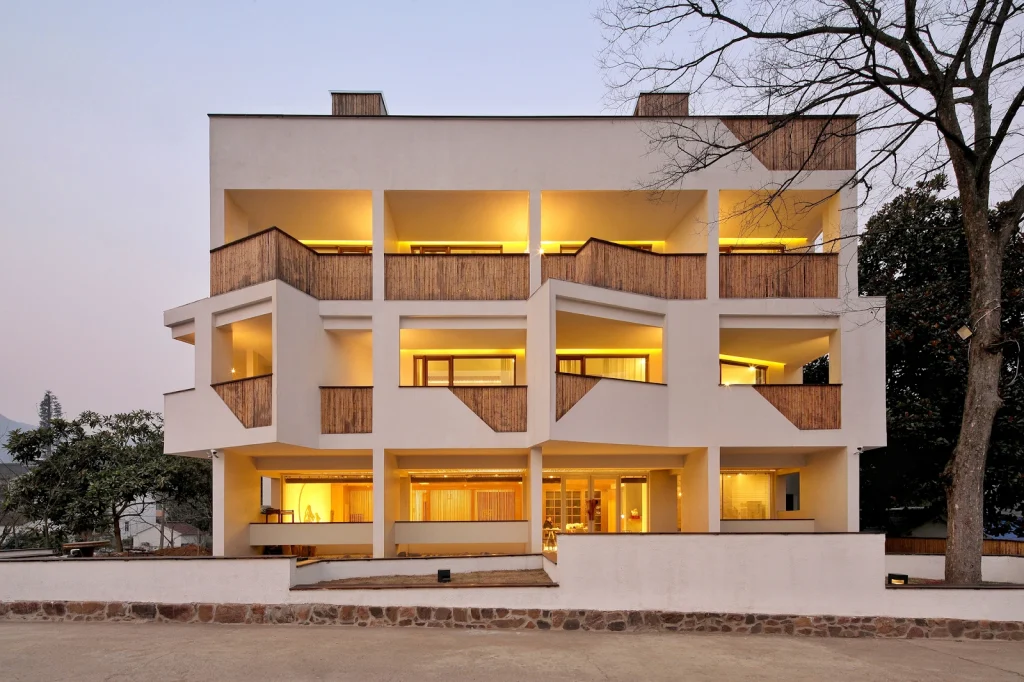 Modern boutique hotel architecture with warm interior lighting