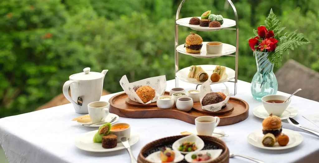 Gourmet afternoon tea set with garden view