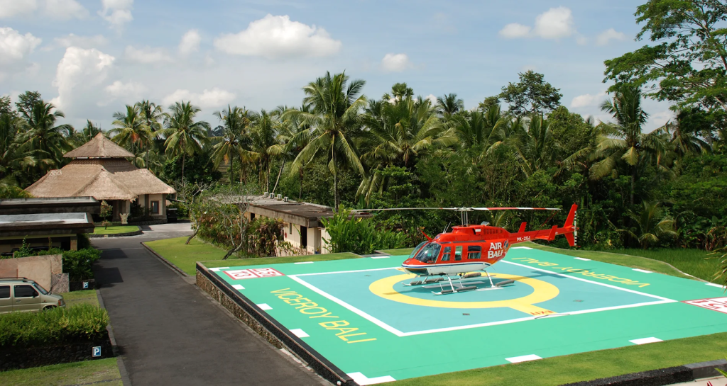A helipad with helicopter at a luxury resort