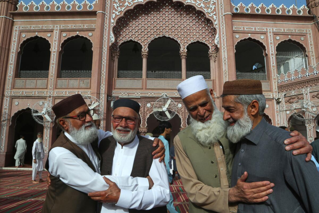 Muslim men standing together smiling