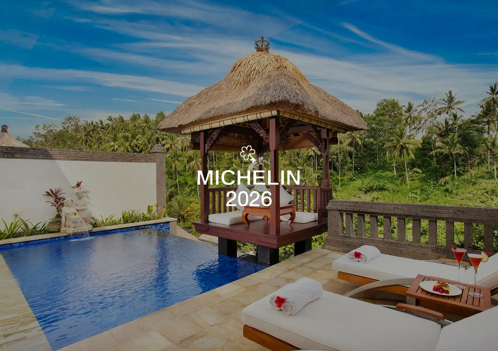 A luxury private pool and thatched-roof bale overlooking the tropical jungle, featuring a Michelin 2026 award overlay for a boutique retreat Ubud.